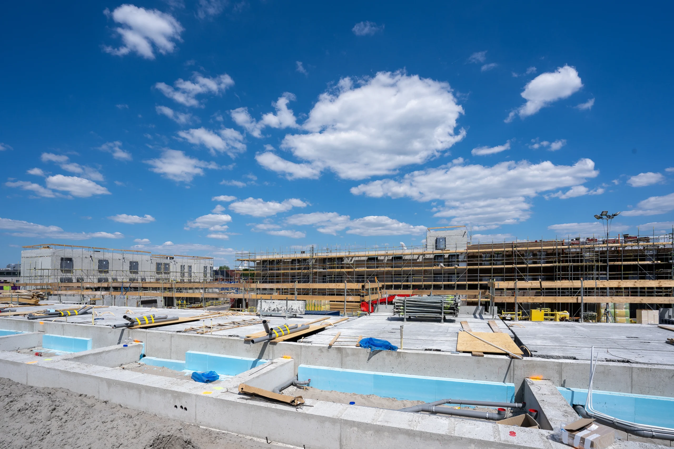 horizontal-shot-construction-site-with-scaffolding-clear-blue-sky